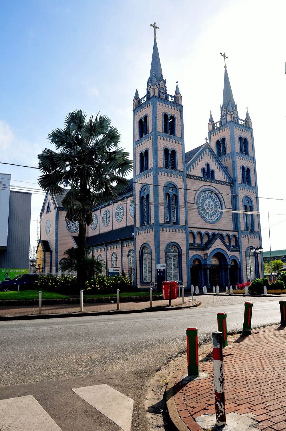 The twin wooden towers and rose window of the Saint Peter and Paul Cathedral-Basilica on Henck Arronstraat, Paramaribo.